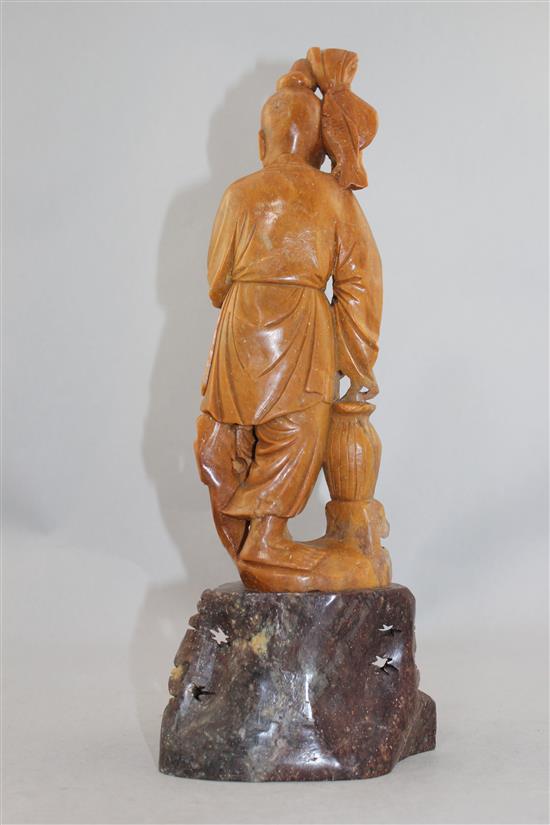 A Chinese soapstone figure of a fisherman, early 20th century, 36cm.